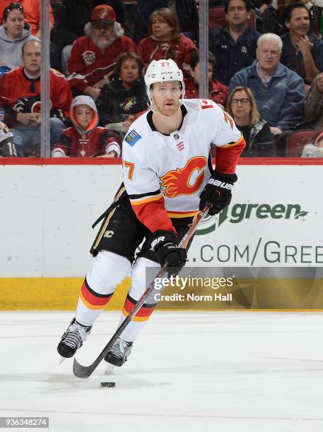 Dougie Hamilton of the Calgary Flames skates with the puck against the Arizona Coyotes at Gila River Arena on March 19, 2018 in Glendale, Arizona.