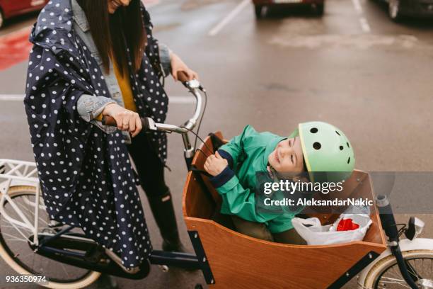 amazing cargo bike ride - cycling helmet stock pictures, royalty-free photos & images