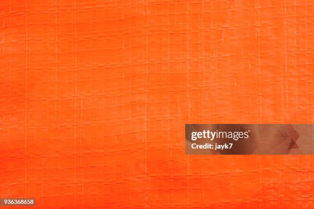 orange plastic sheet background - oranje achtergrond stockfoto's en -beelden