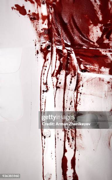 white shirt sopping with blood - blood stain stock-fotos und bilder