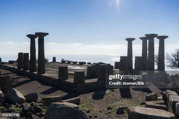 landscape of ruins temple of athena at assos - ehemalige griechische währung stock-fotos und bilder