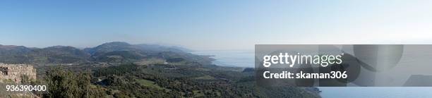 panorama landscape of ruins temple of athena at assos - ehemalige griechische währung stock-fotos und bilder
