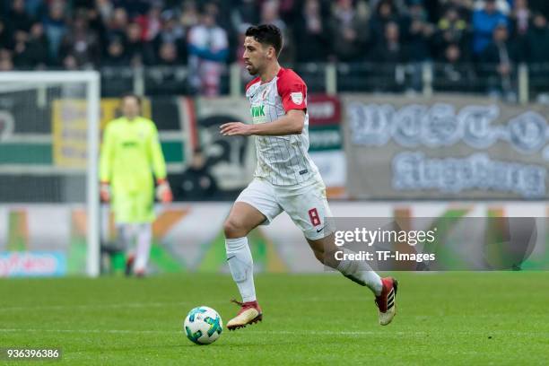 Rani Khedira of Augsburg controls the ball during the Bundesliga match between FC Augsburg and SV Werder Bremen at WWK-Arena on March 17, 2018 in...