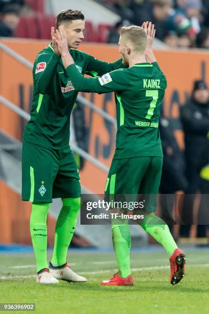 Marco Friedl of Bremen comes on as a substitute for Florian Kainz of Bremen during the Bundesliga match between FC Augsburg and SV Werder Bremen at...