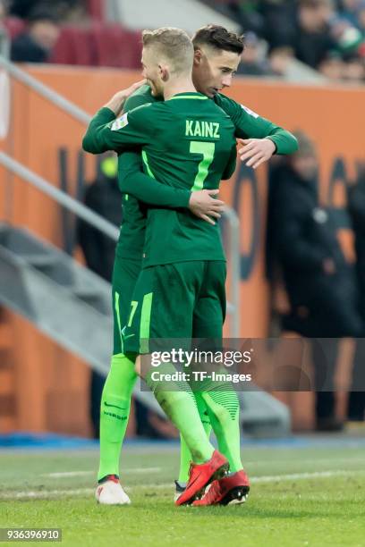 Marco Friedl of Bremen comes on as a substitute for Florian Kainz of Bremen during the Bundesliga match between FC Augsburg and SV Werder Bremen at...