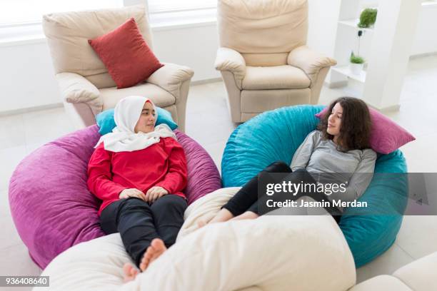 friends relaxed at home - hijab feet stock pictures, royalty-free photos & images