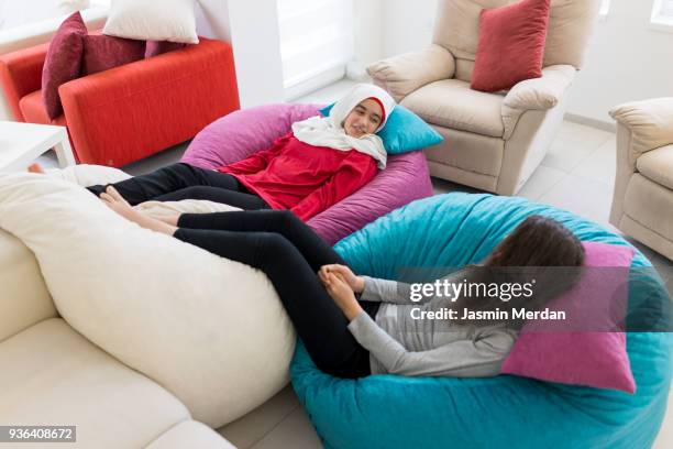 friends relaxed at home - hijab feet stock pictures, royalty-free photos & images