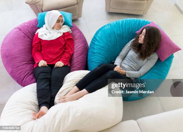 friends relaxed at home - hijab feet stock pictures, royalty-free photos & images