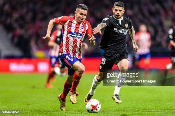 Angel Correa of Atletico de Madrid in action against Ever Banega of Sevilla FC fights for the ball with during the Copa del Rey 2017-18 match between...