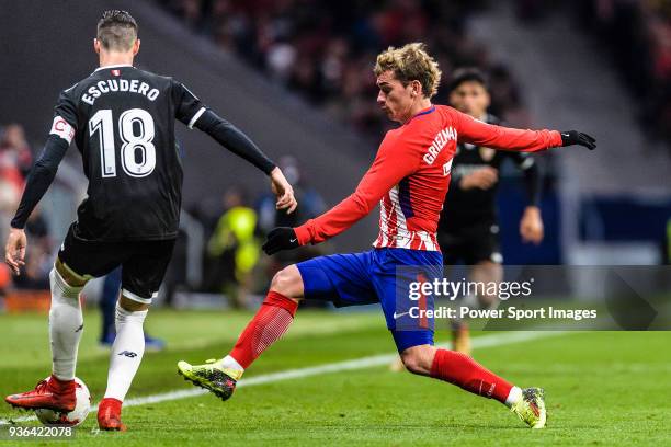 Antoine Griezmann of Atletico de Madrid fights for the ball with Sergio Escudero of Sevilla FC during the Copa del Rey 2017-18 match between Atletico...