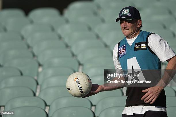 Craig Bradley of the Australian International Rules Team collects balls from the grand stands during this afternoons training session, in preperation...