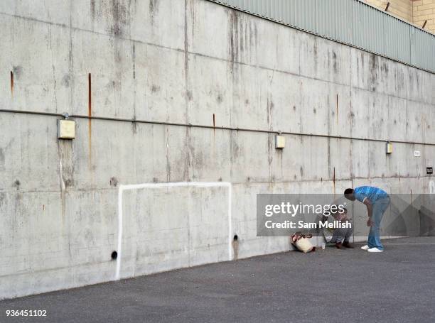 Young family ahead of the Dulwich Hamlet FC vs Sierra Leone, charity game, at Champion Hill on 17th September 2017 in South London in the United...