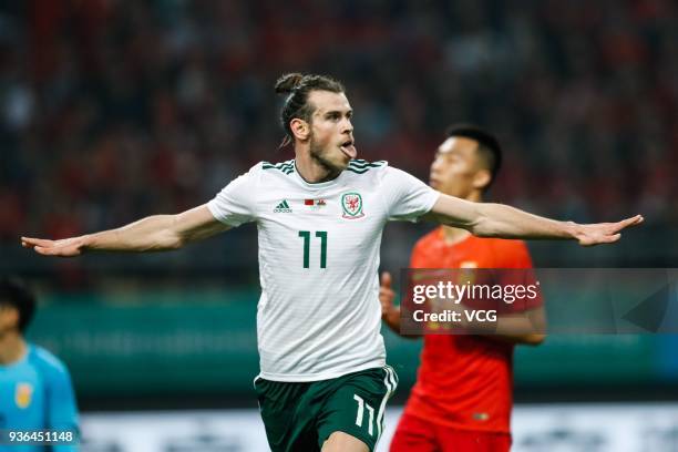 Gareth Bale of Wales celebrates after scoring his team's second goal during the 2018 China Cup International Football Championship match between...