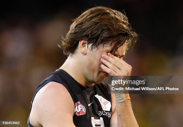 Caleb Marchbank of the Blues looks dejected after a loss during the 2018 AFL round 01 match between the Richmond Tigers and the Carlton Blues at the...
