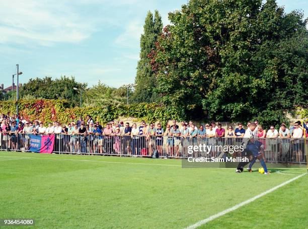 Crowds watch Dulwich Hamlet FC Vs Tooting & Mitcham United FC during the 'South London Derby' on August bank holiday Monday on 28th August 2017 in...