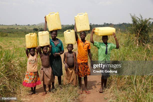 Ugandan children fetching water. Uganda.