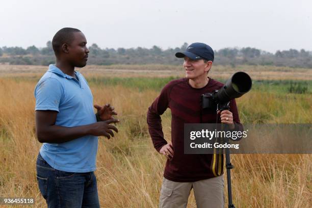 Tourist and guide in Murchison national park. Uganda.