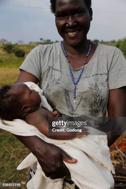 Ugandan catholic mother and baby. Uganda.