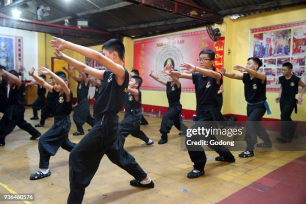 Boys practicing martial arts. Ho Chi Minh City. Vietnam.