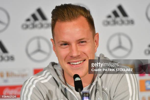 Marc-Andre Ter Stegen, goalkeeper of the German national football team, smiles during a press conference on the eve of the team's international...