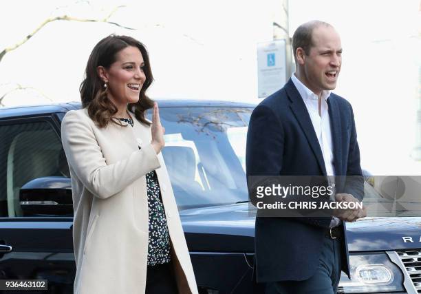 Britain's Prince William, Duke of Cambridge and Britain's Catherine, Duchess of Cambridge gesture on their arrival to undertake engagements...