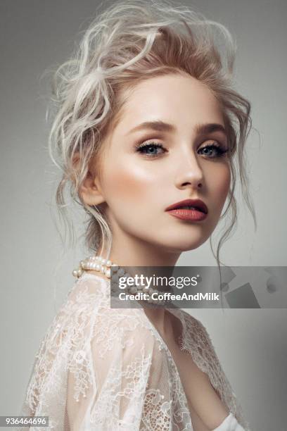 beautiful woman with make-up and stylish hairstyle - fashion glamour pearl stock pictures, royalty-free photos & images