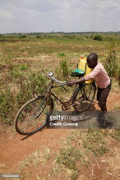Ugandan child fetching water. Uganda.