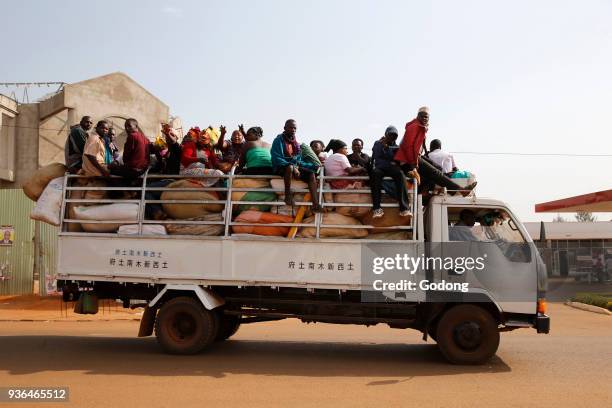 Workers on a goods truck. Uganda.