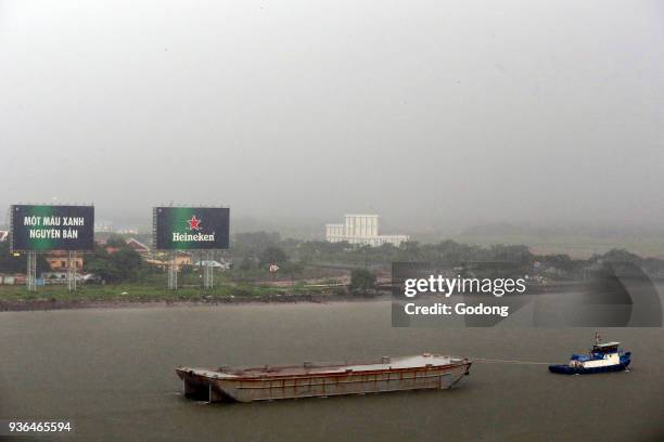 Vietnam, Ho Chi Minh City, ship on Saigon River during Heavy Monsoon Rain. Ho Chi Minh City. Vietnam.