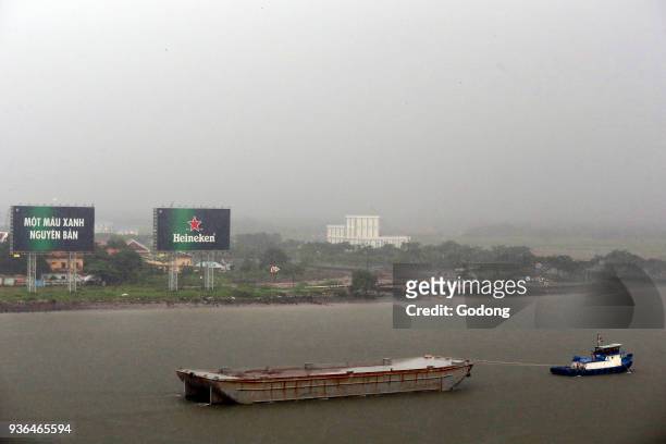 Vietnam, Ho Chi Minh City, ship on Saigon River during Heavy Monsoon Rain. Ho Chi Minh City. Vietnam.