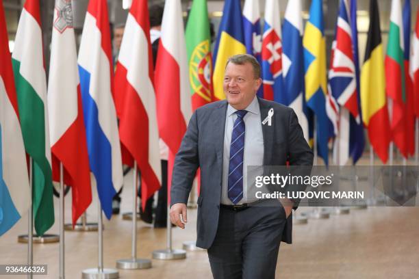 Denmark's Prime minister Lars Lokke Rasmussen arrives on the first day of a summit of European Union leaders at the EU headquarters in Brussels, on...