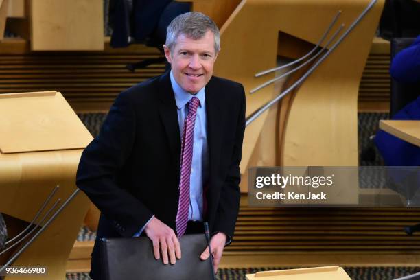 Scottish Liberal Democrat leader Willie Rennie takes his seat for First Minister's Questions in the Scottish Parliament, on March 22, 2018 in...