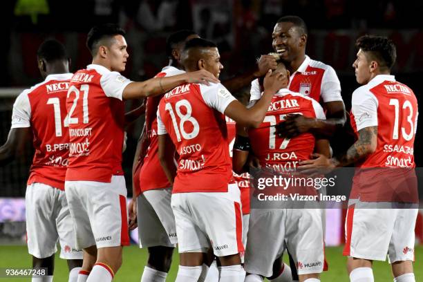 Juan Daniel Roa of Independiente Santa Fe celebrates with teammates after scoring the third goal of his team during a match between Independiente...