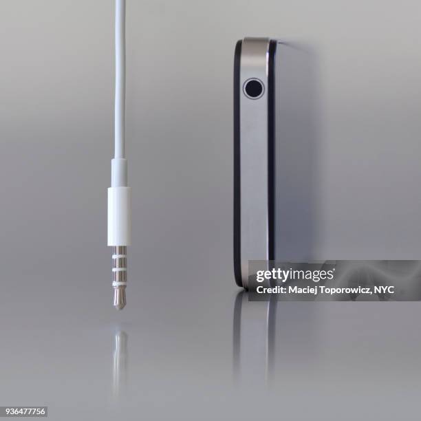 view of a mobile device and a headphone jack. - rca stock pictures, royalty-free photos & images