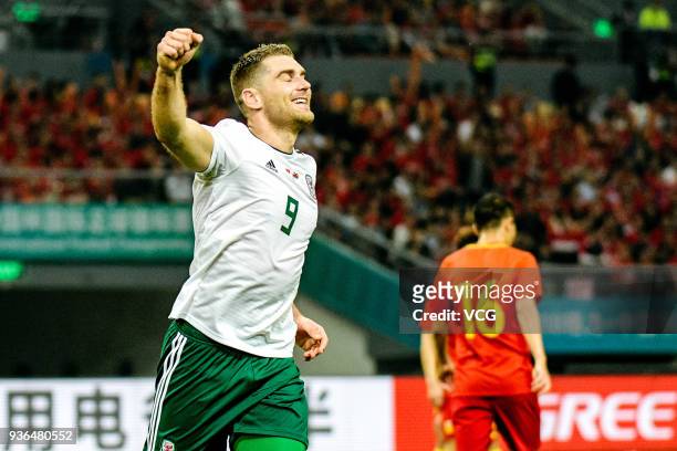 Sam Vokes of Wales celebrates after scoring his team's third goal during the 2018 China Cup International Football Championship match between China...