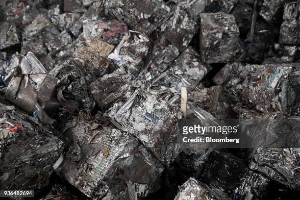Scrap metal sits in a pile in the storage warehouse at the Alumetal Group Hungary Kft. Aluminium processing plant in Komarom, Hungary on Monday,...