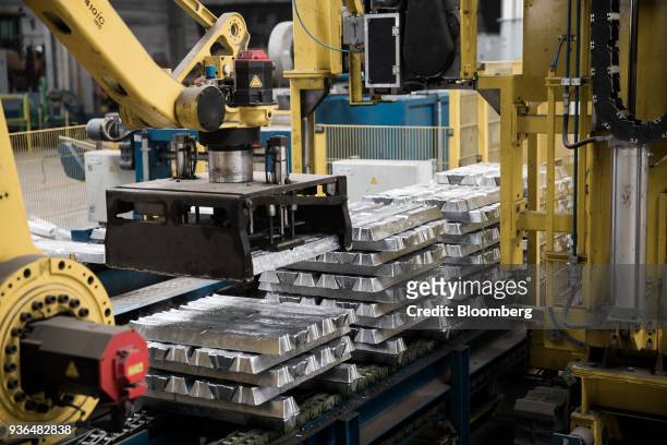 Machine aluminum ingots ahead of binding for shipping at the Alumetal Group Hungary Kft. Aluminium processing plant in Komarom, Hungary on Monday,...