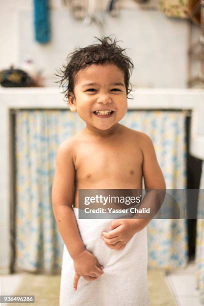 boy wrapped in towel - boy taking a shower stock-fotos und bilder