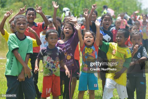 Local children from the native population seen awaiting for the riders on the side of the road during the fifth stage, the mountain stage of 169.4km...