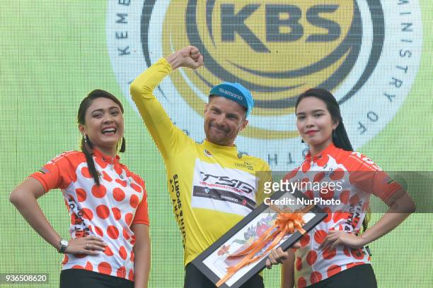 Artem Ovechkin from Terengganu Team takes the Yellow Leader Jersey during the Awards Ceremony after he wins the fifth stage, the mountain stage of...