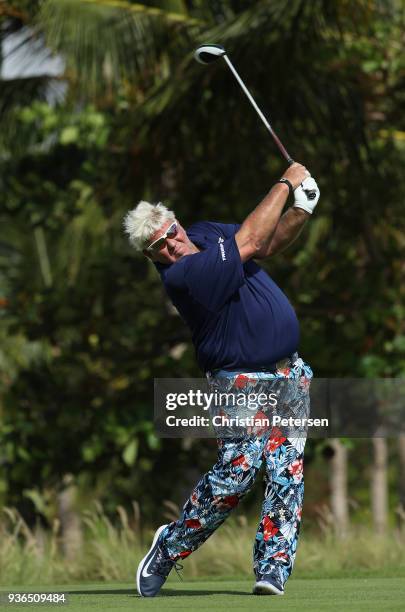 John Daly plays his shot from the seventh tee during round one of the Corales Puntacana Resort & Club Championship on March 26, 2018 in Punta Cana,...