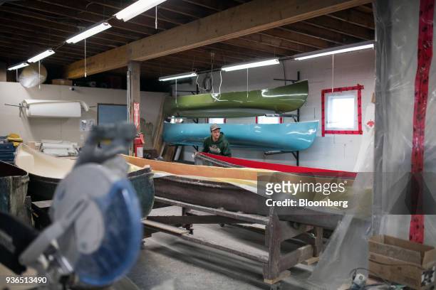 Worker prepares a canoe for fiberglass shell at the Holy Cow Canoe Co. Production facility in Guelph, Ontario, Canada, on Thursday, March 1, 2018....