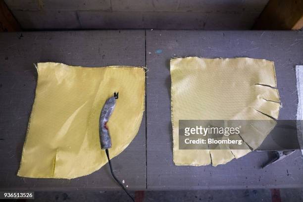 Fibreglass cloth for a canoe shell are seen at a workstation at the Holy Cow Canoe Co. Production facility in Guelph, Ontario, Canada, on Thursday,...