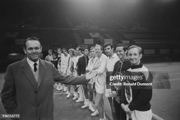 American tennis player and coach Jack Kramer with professional tennis players at the Empire Pool , London, UK, 15th November 1968. Cliff Drysdale,...