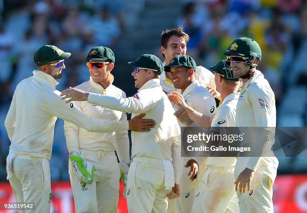 Pat Cummins of Australia celebrate after taking the wicket of Temba Bavuma of South Africa during day 1 of the 3rd Sunfoil Test match between South...