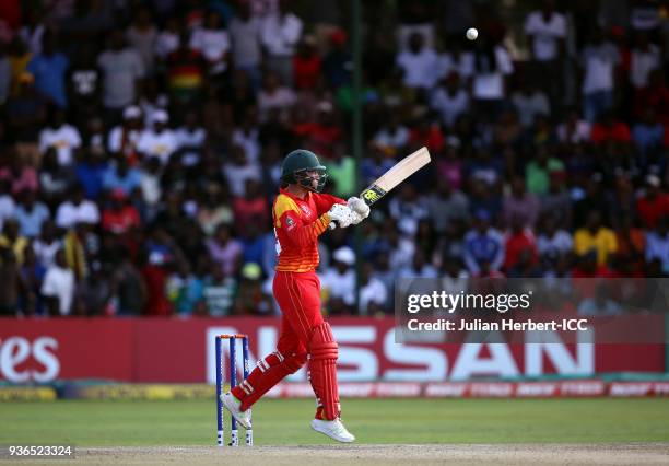 Sean Williams of Zimbabwe scores runs during The ICC Cricket World Cup Qualifier between the UAE and Zimbabwe at The Harare Sports Club on March 22,...