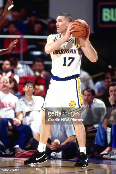 Chris Mullin of the Golden State Warriors handles the ball circa 1994 at the Oakland Coliseum in Oakland, California. NOTE TO USER: User expressly...