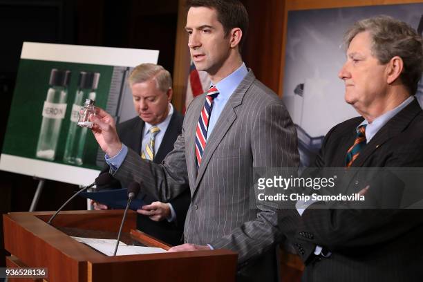 Sen. Tom Cotton holds up a salt shaker with an amount of powder that he said approximates a volume of fentanyl that could kill thousands of people...