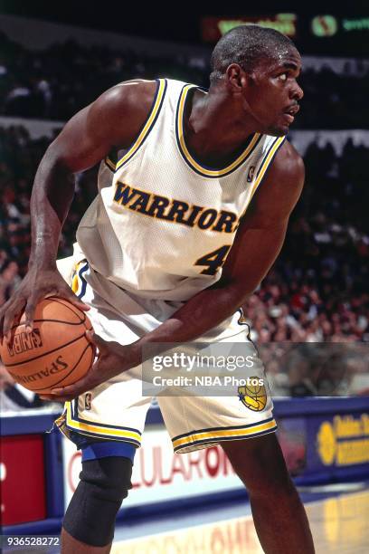 Chris Webber of the Golden State Warriors handles the ball circa 1994 at the Oakland Coliseum in Oakland, California. NOTE TO USER: User expressly...