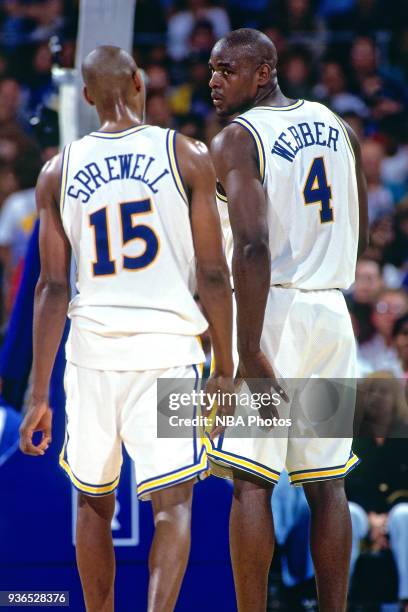 Latrell Sprewell and Chris Webber of the Golden State Warriors look on circa 1994 at the Oakland Coliseum in Oakland, California. NOTE TO USER: User...